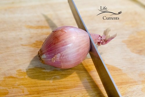 Fried Peanuts with garlic and basil Peeling and slicing a shallot
