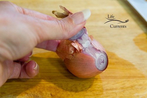 Fried Peanuts with garlic and basil Peeling and slicing a shallot