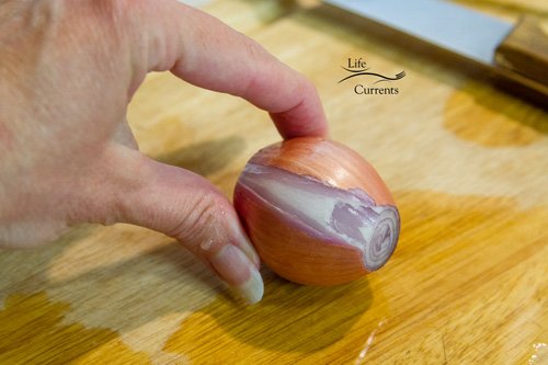 Fried Peanuts with garlic and basil Peeling and slicing a shallot