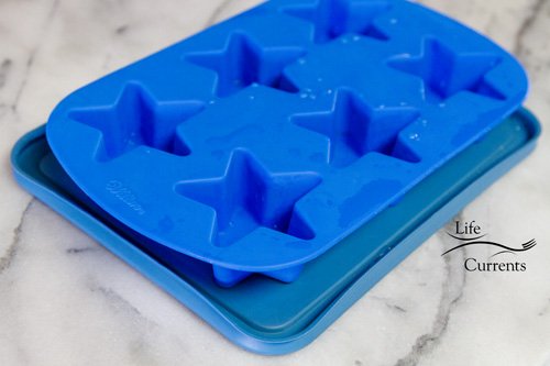 silicone star mold on tupperware lid.