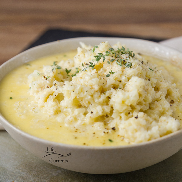 Garlic Parmesan Cauliflower - riced cauliflower in a light garlic cream sauce. healthy, delicious side dish