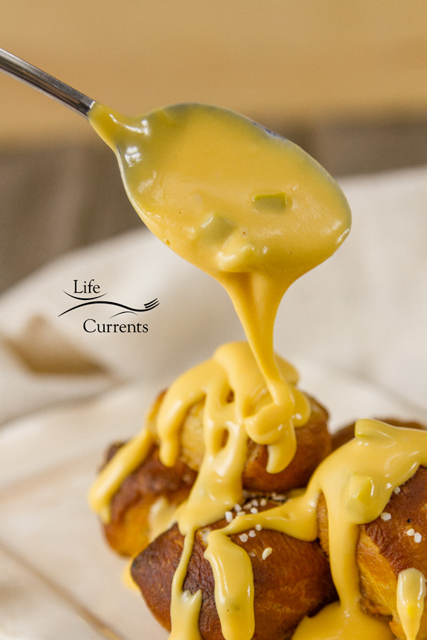 Candied Jalapeno Cheese Sauce is a great rich gooey cheese sauce with a nice sweet heat from the candied jalapenos. 