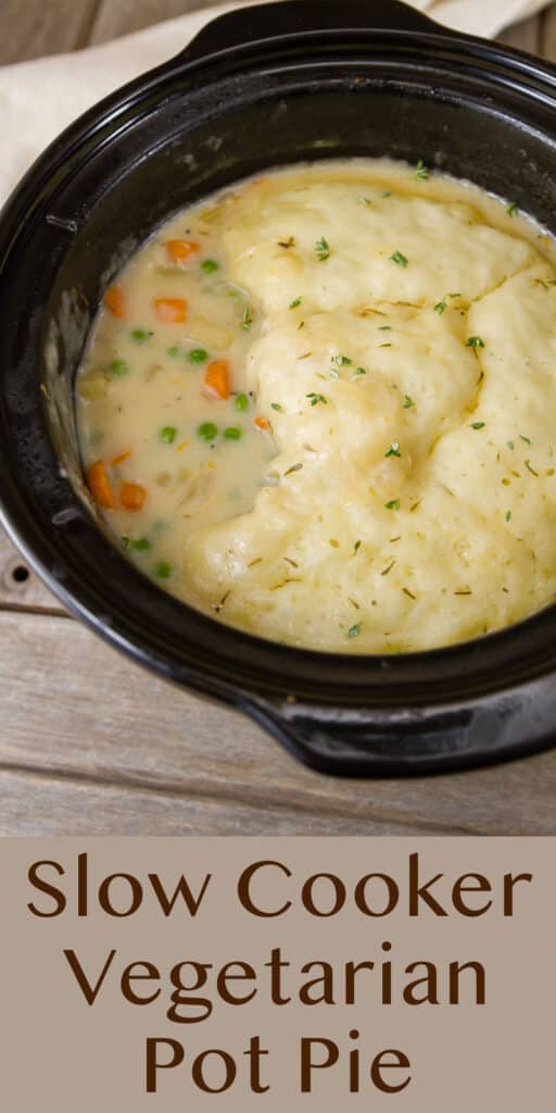 looking down into the black insert of a crock pot that's filled with soup, title underneath Slow Cooker Vegetarian Pot Pie.