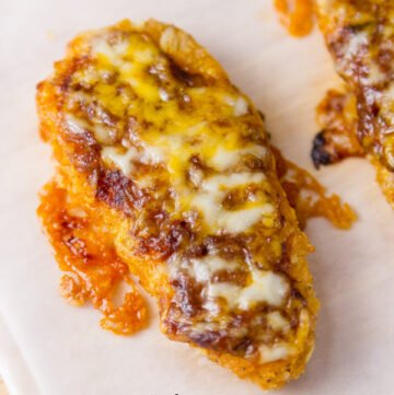 Mexican Chicken Tenders - easy to make, baked, delicious chicken tenders covered with rich enchilada sauce and melted cheese