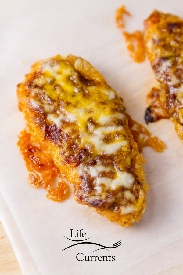 Mexican Chicken Tenders - easy to make, baked, delicious chicken tenders covered with rich enchilada sauce and melted cheese