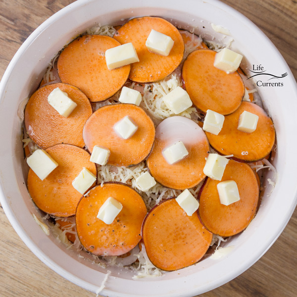 Sweet Potato Layer Bake - all layers of are in, and the casserole is topped with butter Sweet Potato Layer Bake - all layers of are in, and the casserole is topped with butter