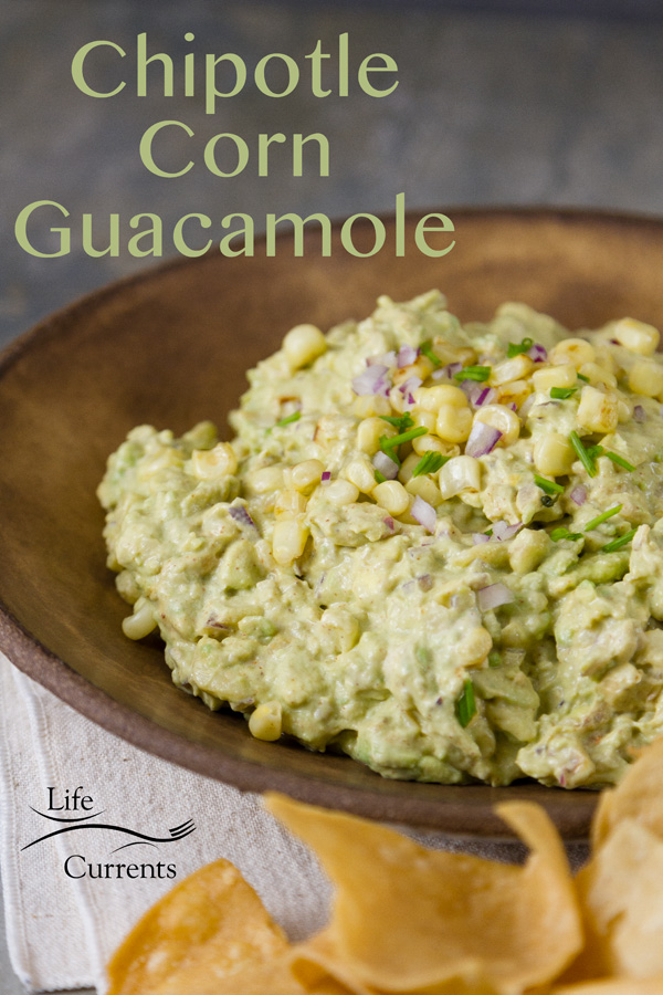 Chipotle Corn Guacamole Recipe sppetizer dip in a brown bowl served with chips 