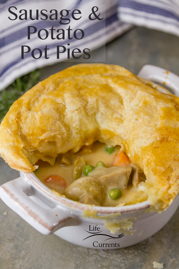 Sausage and Potato Pot Pie - These individual pot pies are simply delicious! A hearty sausage stew with earthy potatoes in a creamy delicious gravy all covered in flakey puff pastry. 