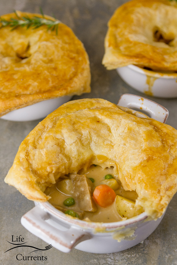 Sausage Pot Pie - Amazingly delicious individual pot pies filled with sausage, potatoes, carrots, peas, and a creamy gravy