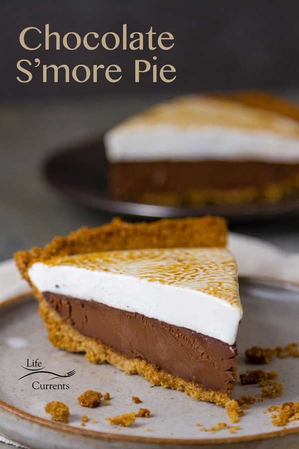 Chocolate S&rsquo;More Pie  Freshly toasted homemade marshmallows top creamy delicious dark chocolate ganache all nestled in a golden graham cracker crumb crust. This pie makes it impossible to resist a slice, or maybe two. 