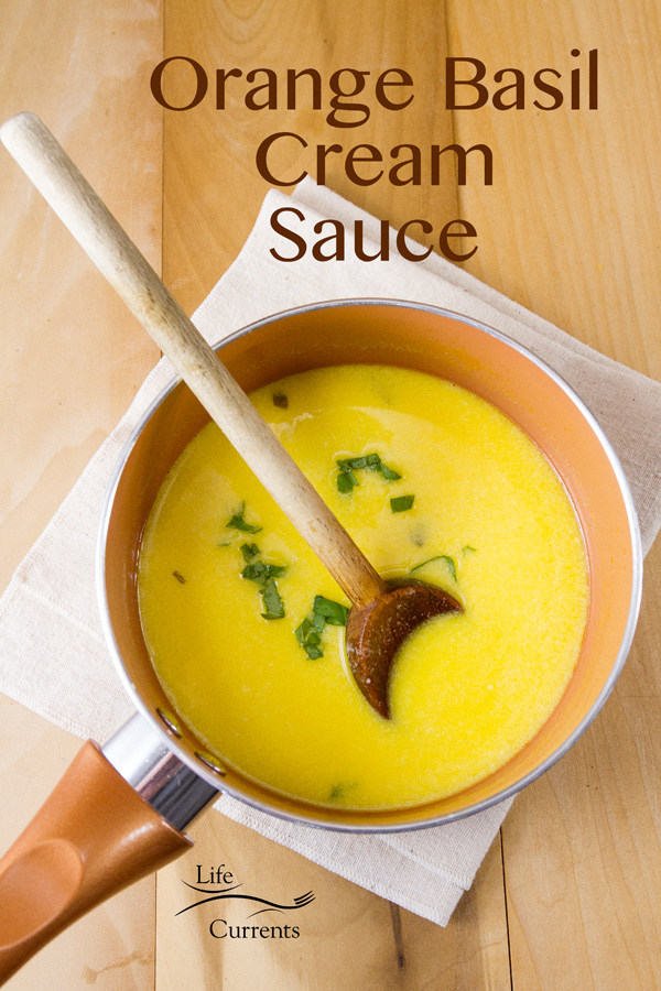 Orange Basil Cream Sauce - An unforgettable buttery cream sauce with sweet tangy orange and fresh basil. This sauce works so well with pasta, fish, or chicken. It&rsquo;ll be a house favorite.
