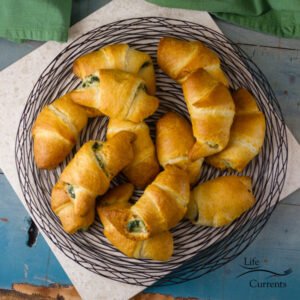 Spinach Mushroom Crescents &ndash; I always love having a side dish or an appetizer that has a little sneaky vegetable inside. And, these are a great way to do that. The filling looks pretty as it sticks out, and adds a nice flavor to the crescents.