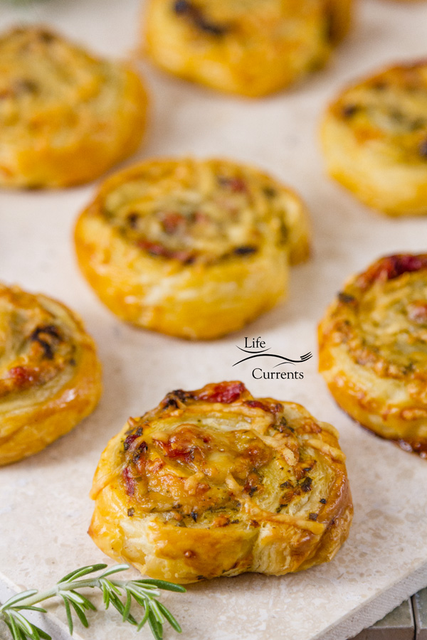 Pesto Puff Pastry Pinwheels with Sun Dried Tomatoes and Roasted Red Peppers make a great light lunch or after work or school snack.