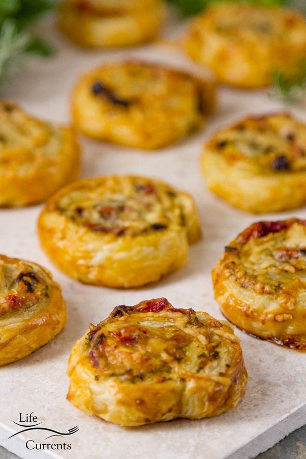 Pesto Puff Pastry Pinwheels with Sun Dried Tomatoes and Roasted Red Peppers easy to make and delicious Italian Mediterranean party snack foods