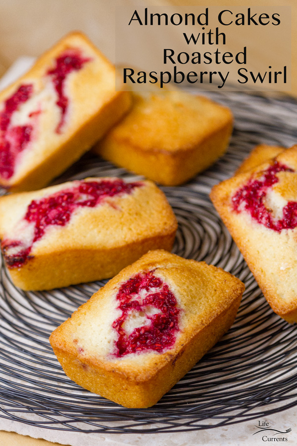 Almond Cakes with Roasted red Raspberry Swirl out on a wire rack ready to be served with text describing the title of the recipe