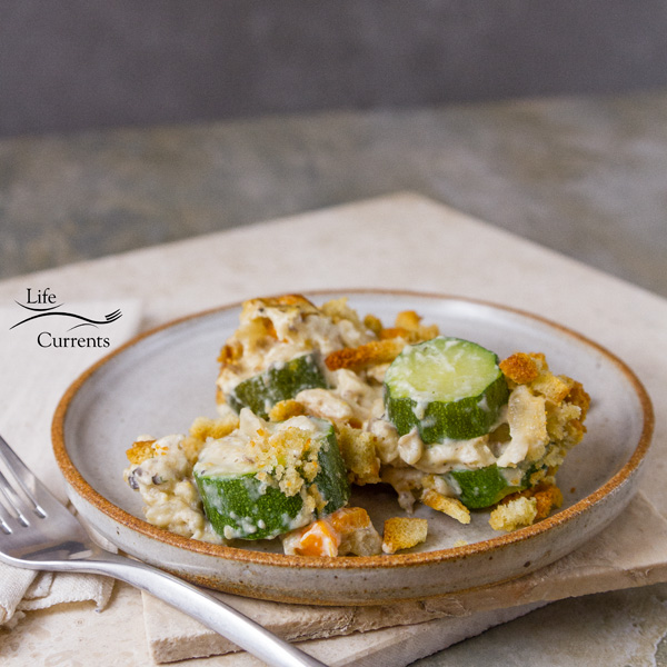 A serving of the veggie filled vegetarian casserole on a white dish 