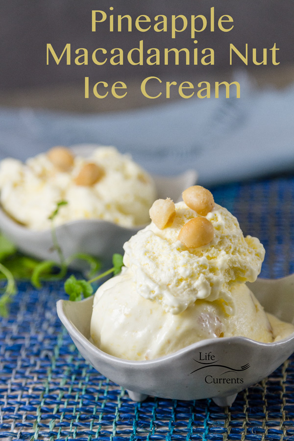 Two white bowls with pineaplle ice cream with macadamia nuts on a blue fabric