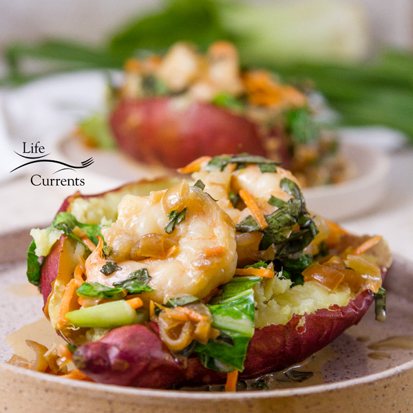 two servings of Thai Basil Shrimp stuffed in sweet potatoes