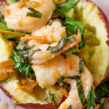 shrimp and veggies stuffed in a baked sweet potato