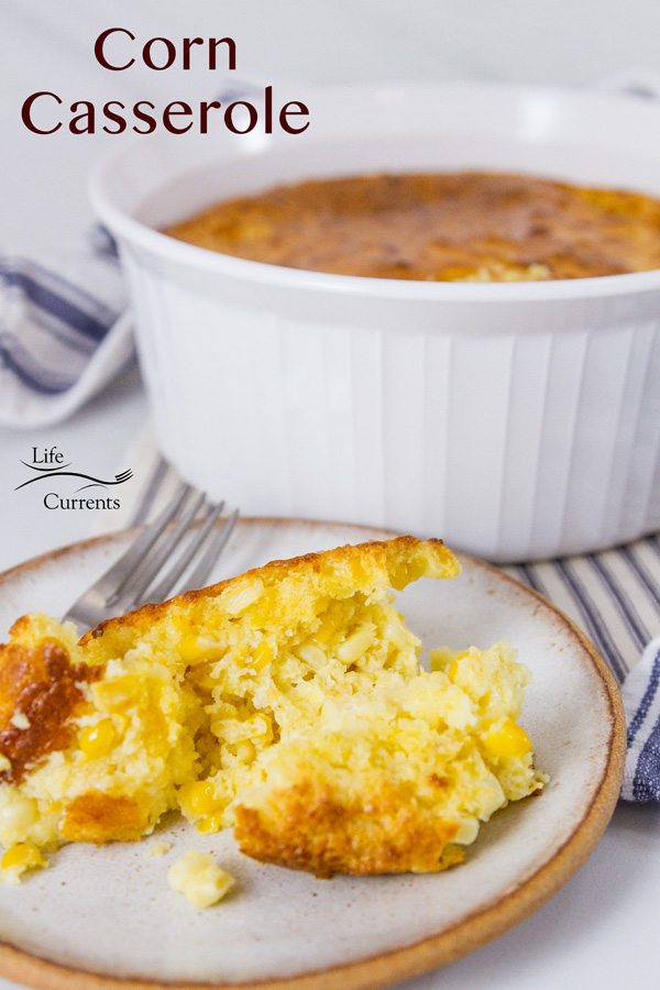 corn casserole a serving in front and the whole dish in the back