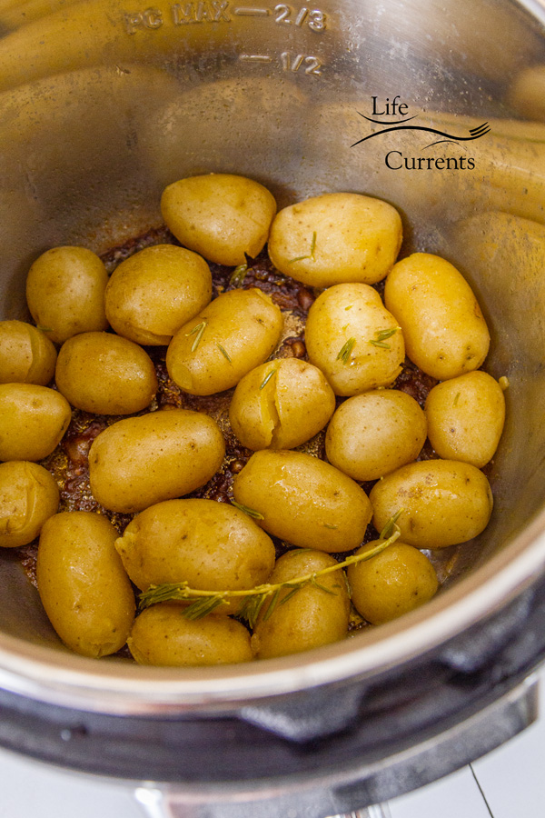 The potatoes during the saute mode. All of the broth has evopated and browned in the bottom of th epan. 