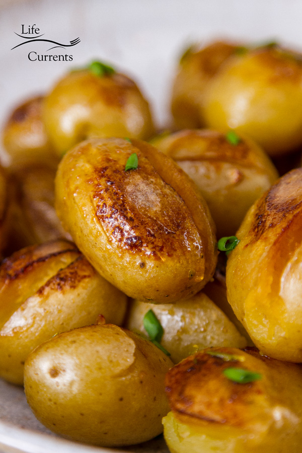a close up of the browned edges of the cooked baby potatoes 