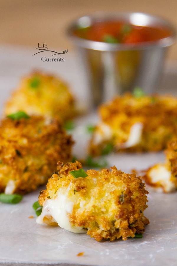 They were amazing. Crunchy on the outside. Cheesy on the inside. Not greasy at all (like so many you get at restaurants). I actually prefer these homemade air fryer mozzarella bites to those that you get at restaurants. These were way better! serveral breaded mozzarella bites with cheese oozing out garnished with green onions and served with marinara sauce