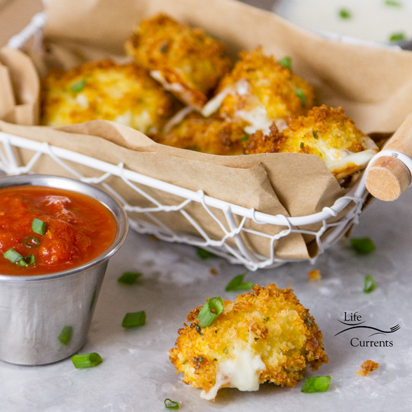 Air Fryer Mozzarella Sticks Who doesn’t love a good stringy crunchy on the outside, gooey on the inside Mozzarella Cheese Stick! And, when they’re made in the Air Fryer with no mess, way less fat and calories, and no greasy taste, this is a win-win! Air Fryer Mozzarella Bites served in a wire basket with a brown paper liner with one mozzarella bite in front, the cheese has oozed out a bit and served with a tin ramekin of marinara sauce
