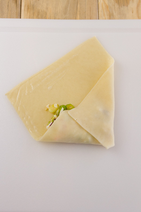 How to roll an Egg Roll: folding in the sides so that the filling is contained. 