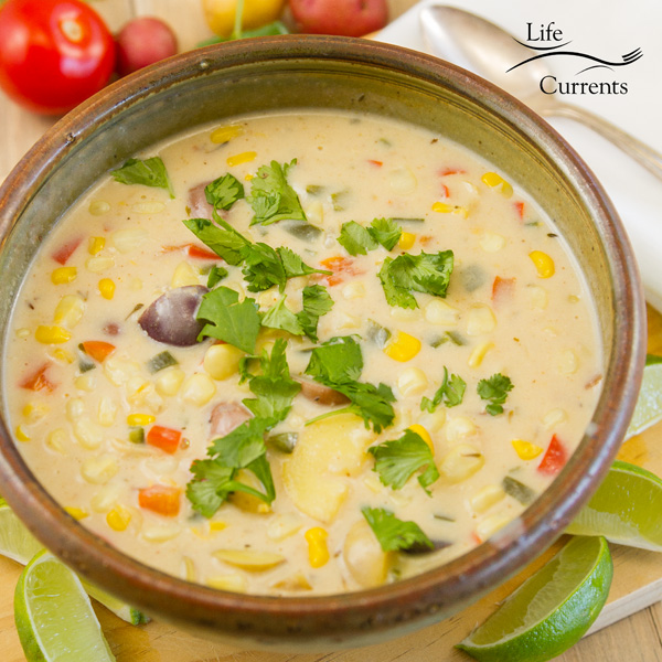 a bowl full of Southwestern Corn Chowder garnished with cilantro 