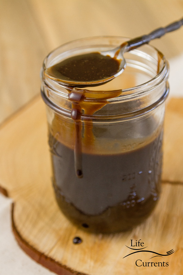 Dessert mocha caramel sauce in a mason jar with a spoon 