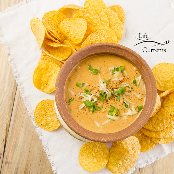 top down view of Mexican Chili Cheese Dip with tortilla chips 