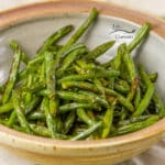 cooked green beans in a bowl.