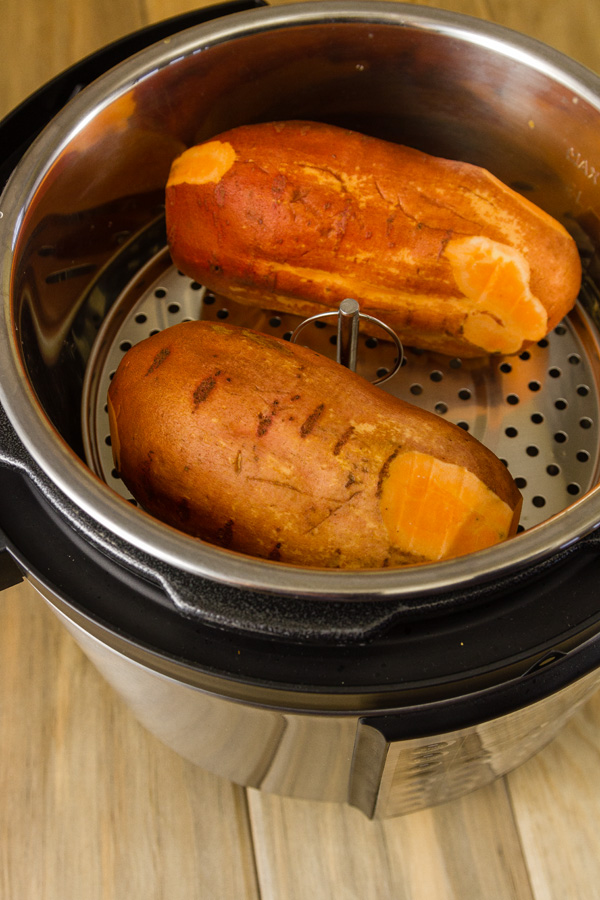 two sweet potatoes in a pressure cooker