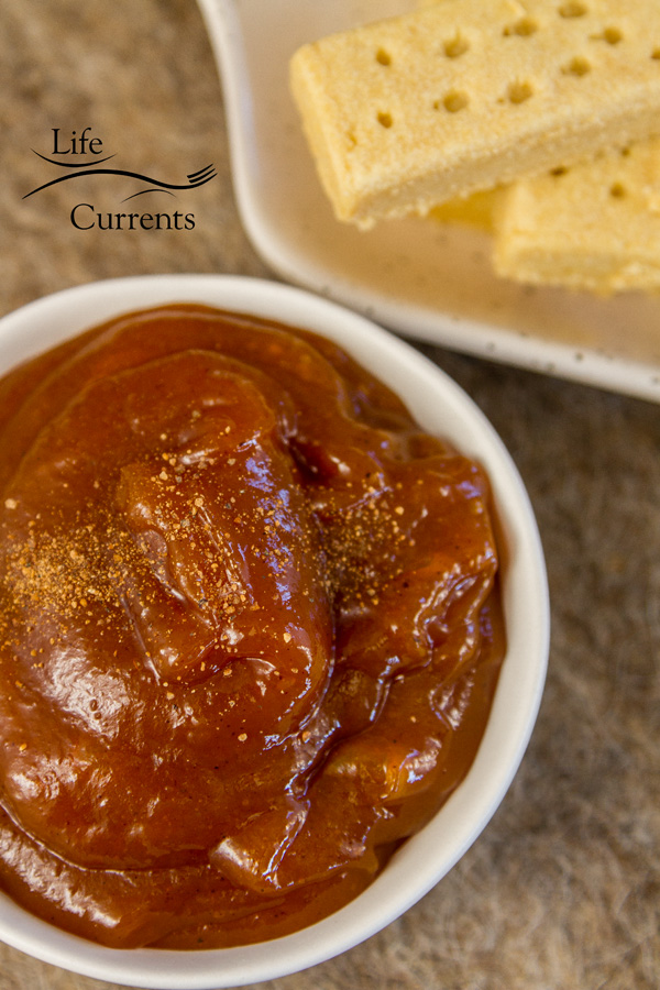 a dish of pumpkin butter with some shortbread cookies 
