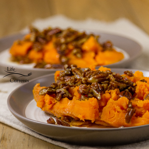 square crop two sweet potato halves with pecan sauce 