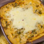 vertical image of Cheesy Fiesta Spinach Dip with tortilla chips