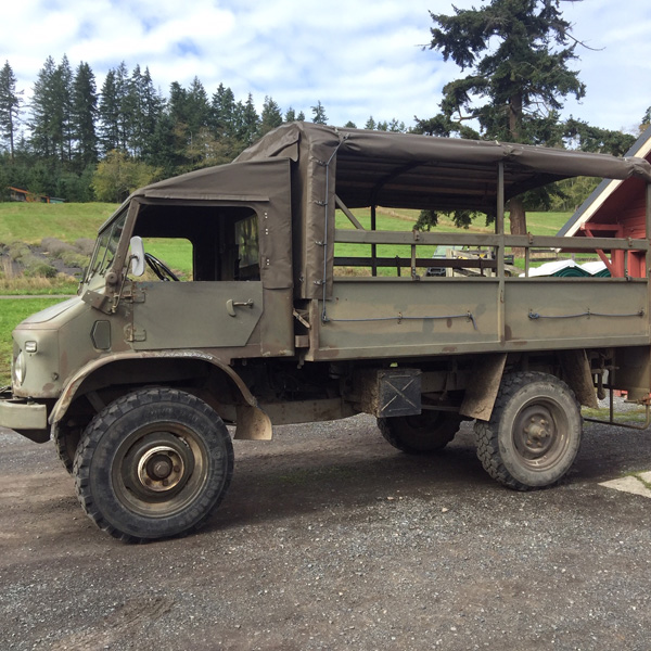 Unimog vehicle, which is a 1963 Swiss Army troop carrier