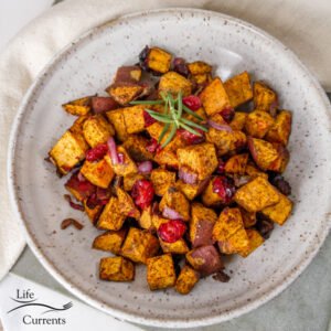 square crop of air fryer roasted sweet potatoes in a white bowl
