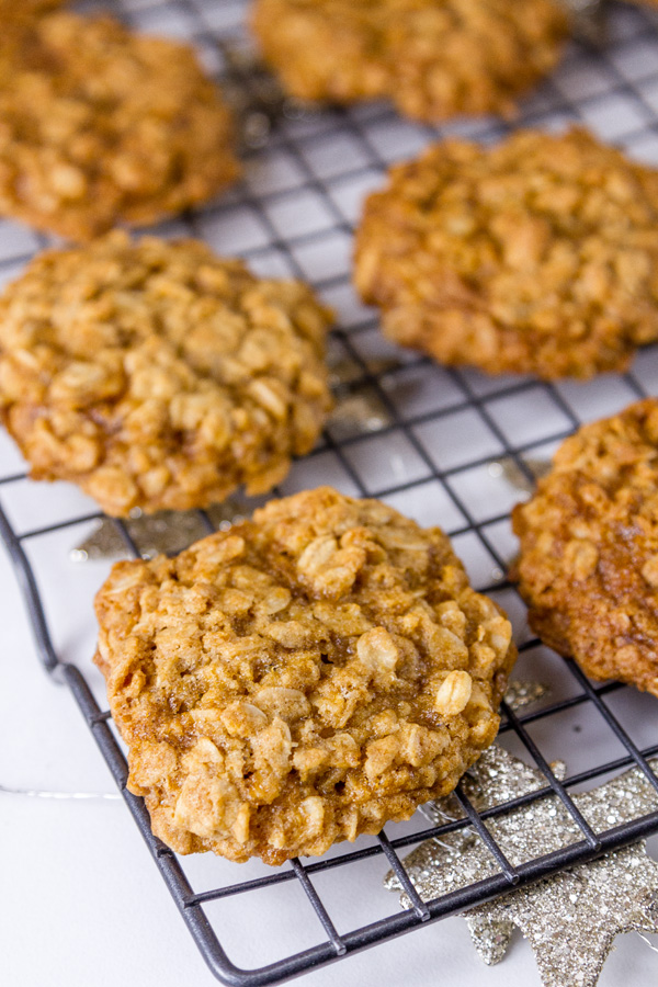 Crispy edges, chewy in the middle, and wholesome perfectly balanced Famous Oatmeal Cookies. These are my favorite cookies, and they are the classic original recipe! So good, they’re famous. In fact, this is the original recipe from the side of the oatmeal carton that my mom always made when I was a kid. oatmeal cookies on a cooling rack