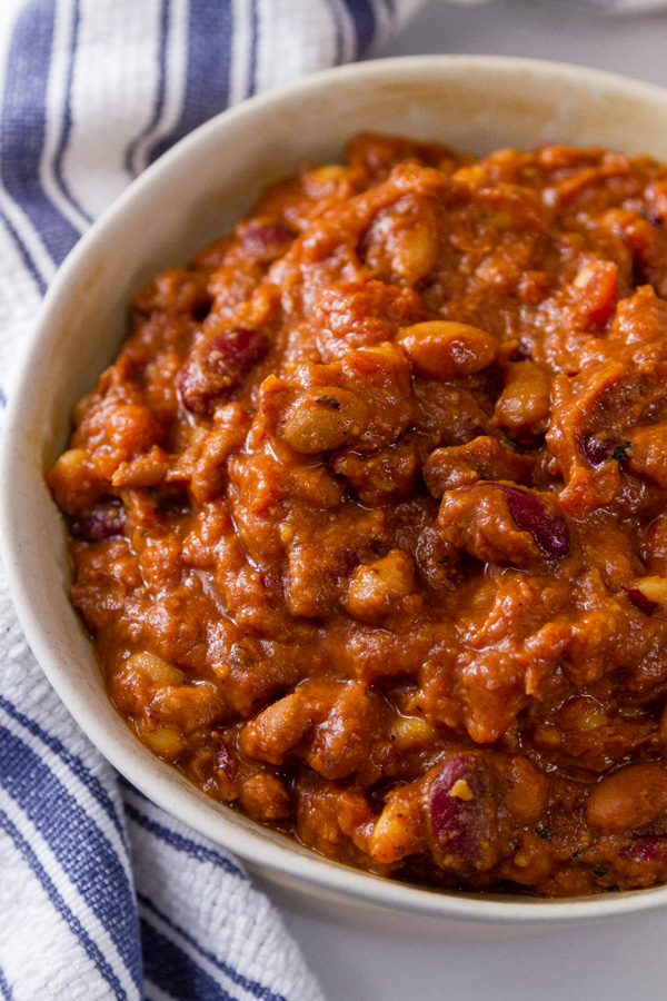 A big bowl of Crock Pot Vegetarian Chili with a blue striped towel 