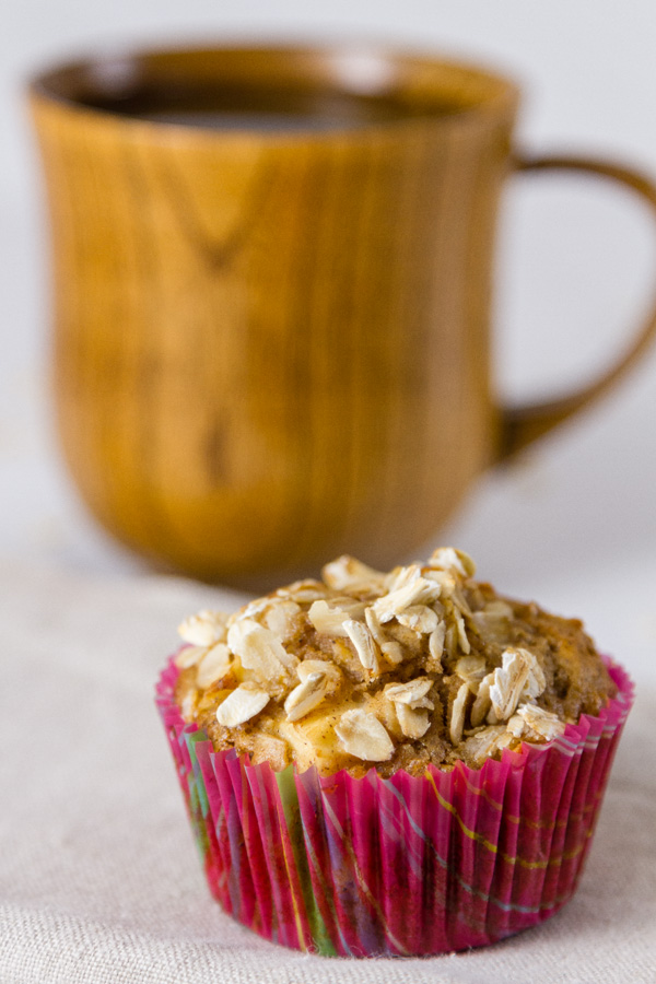 an apple oatmeal muffin with a cup of coffee is a great way to start the day 