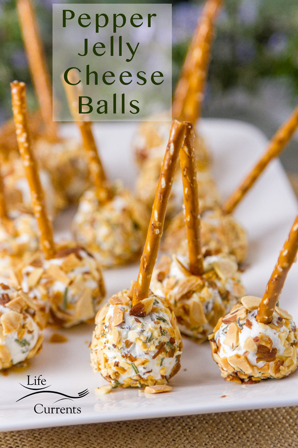 Pepper Jelly Cheese Balls on a white plate with pretzle sticks as handles with the title
