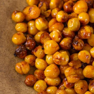 close up of Buffalo Roasted Chickpeas on a brown plate