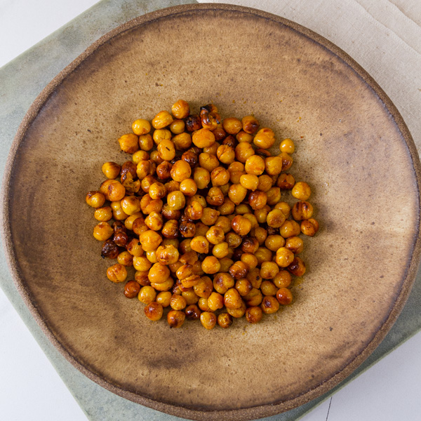 square crop of Buffalo Roasted Chickpeas in a brown bowl
