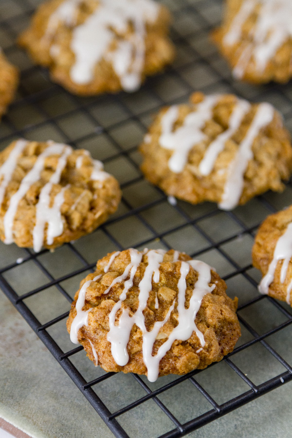 Chewy Eggnog Oatmeal Cookies with crispy edges and the classic festive taste of eggnog. These will be a hit with your family and Santa. eggnog oatmeal cookies on a cooling rack