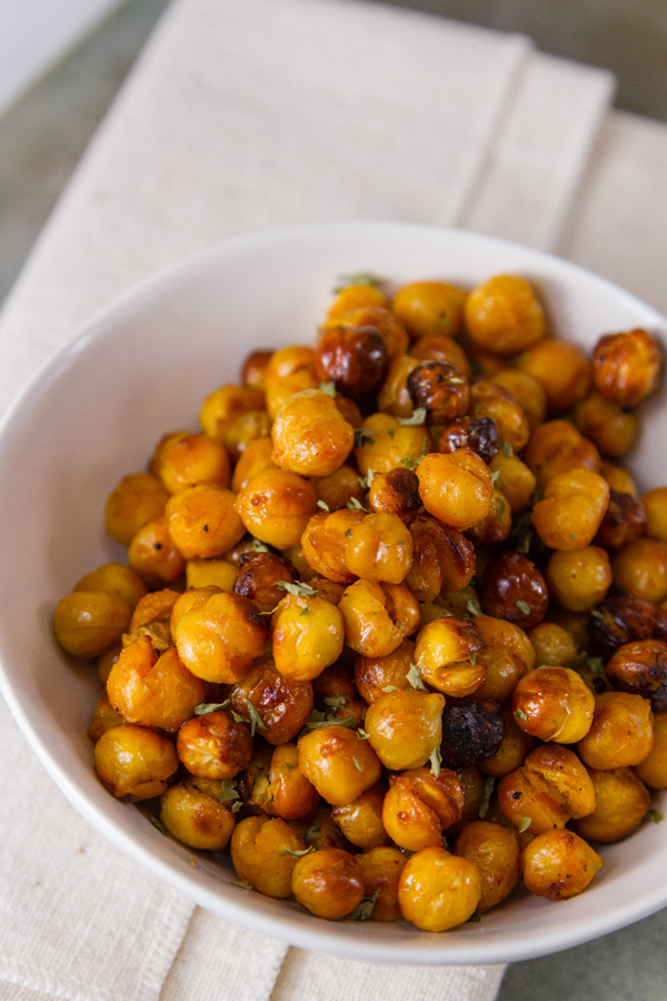 Buffalo Roasted Chickpeas in a white bowl on a white napkin