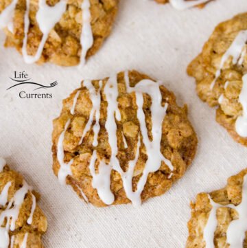 square crop of eggnog oatmeal cookies with icing on a napkin