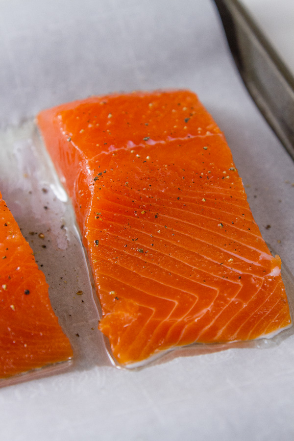 Super fresh COHO Salmon cut into fillets on a baking tray 