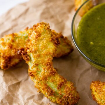 Air Fryer Avocado Fries served with Cheesecake Factory Copycat Tamarind-Cashew Dipping Sauce on a brown paper